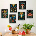 Six finished Mystic Folk mini paintings hung on a wall above a table