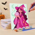 Painting a Mystic Moon Witches mini canvas propped up beside numbered acrylic paints