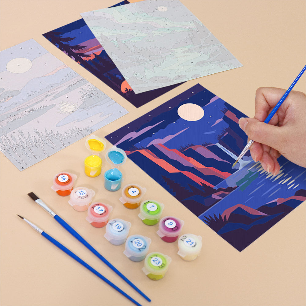 Filling in a Night Sky Journeys mini canvas with numbered acrylic paints and a fine brush