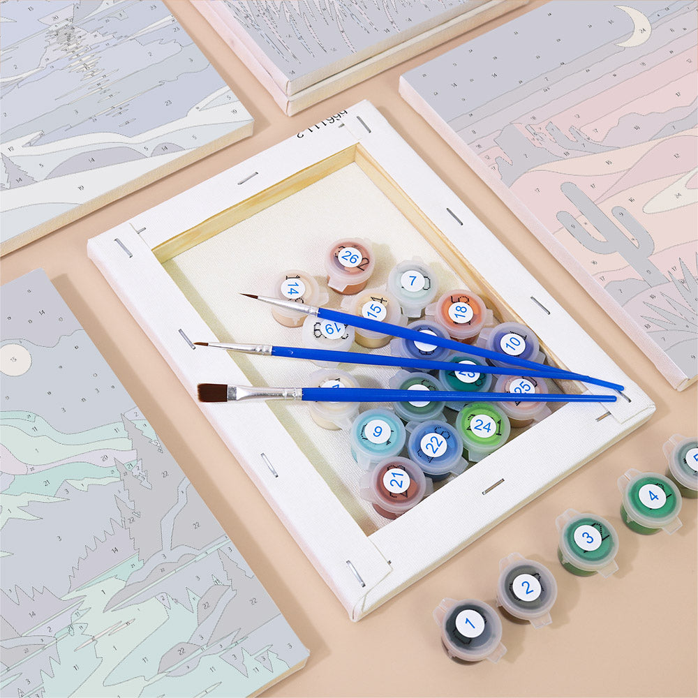 Numbered paint pots and brushes on a pre-stretched Night Sky Journeys mini canvas