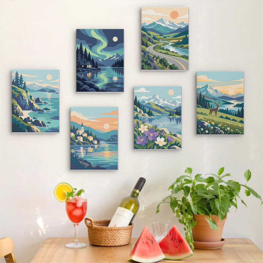 Six finished Northern Wilds mini paintings hung on a wall above a table