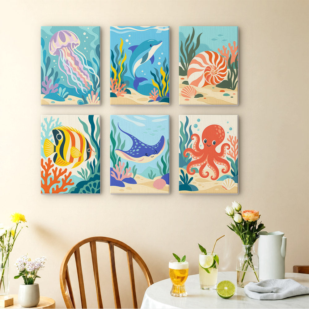 Ocean Friends mini paintings displayed as a gallery wall in a sunny kitchen
