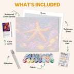 What's included in the Ocean's Shining Star paint by numbers kit: numbered linen canvas, reference sheet, color guide, 24 acrylic paints, 3 brushes and thank you card