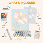 What's included in the Orange hibiscus paint by numbers kit: numbered linen canvas, reference sheet, color guide, 24 acrylic paints, 3 brushes and thank you card