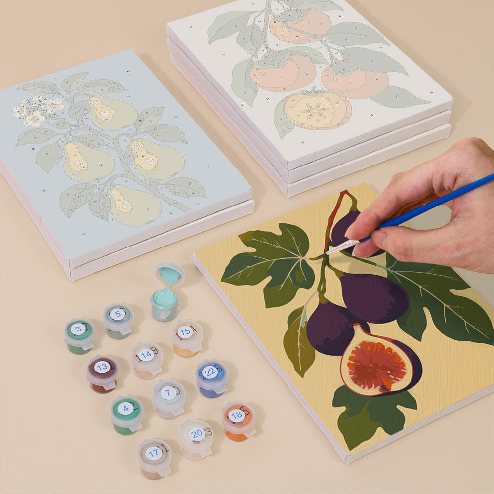 Painting one of the Orchard Harvest designs next to a stack of mini canvases