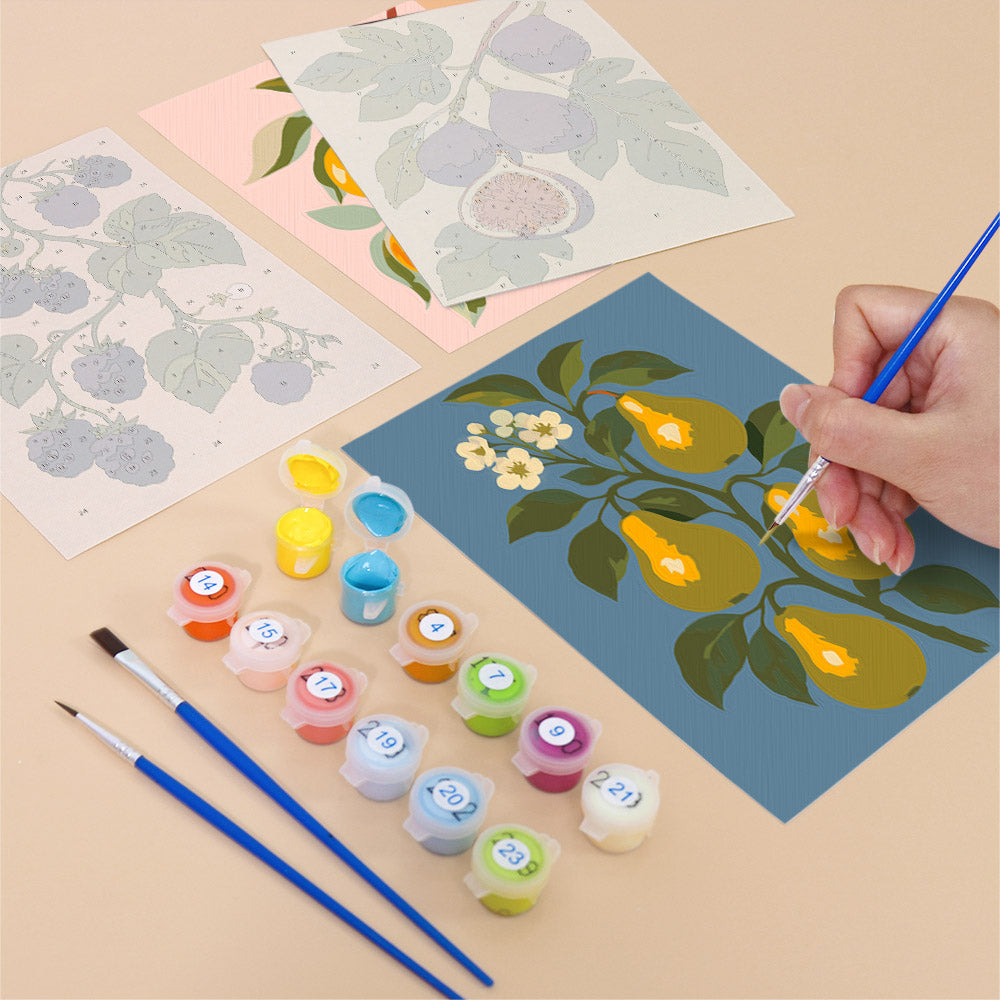 Filling in an Orchard Harvest mini canvas with numbered acrylic paints and a fine brush