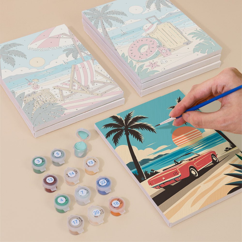 Painting one of the Palm Beach Holiday designs next to a stack of mini canvases