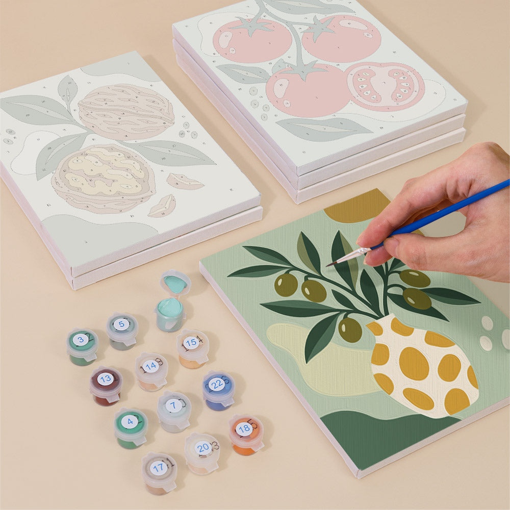 Painting one of the Pantry Harvest designs next to a stack of mini canvases