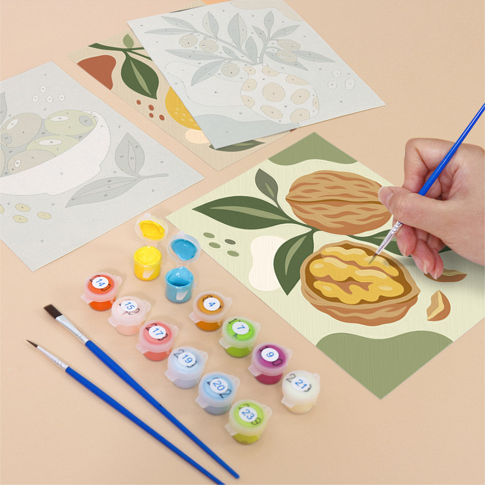 Filling in a Pantry Harvest mini canvas with numbered acrylic paints and a fine brush