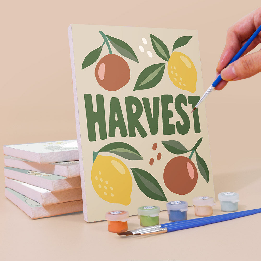 Painting a Pantry Harvest mini canvas propped up beside numbered acrylic paints