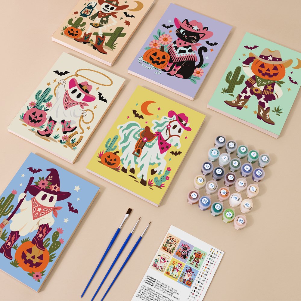 Painting one of the Pastel Cowboy Spooks designs next to a stack of mini canvases
