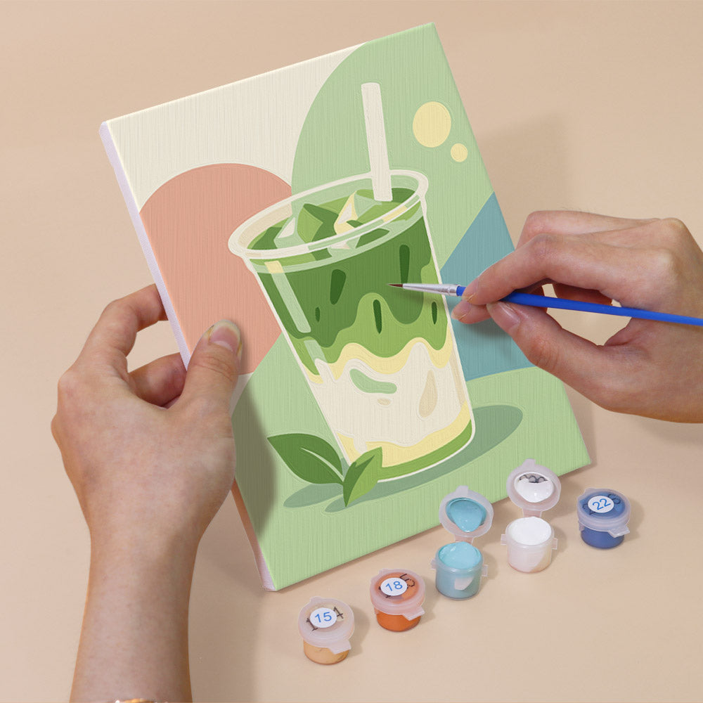 Hand holding a Pastel Favorites mini canvas while painting the details