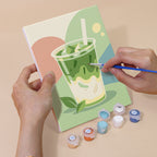 Hand holding a Pastel Favorites mini canvas while painting the details