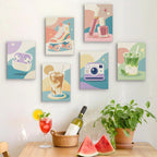 Six finished Pastel Favorites mini paintings hung on a wall above a table