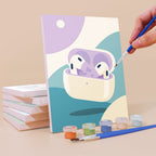 Painting a Pastel Favorites mini canvas propped up beside numbered acrylic paints