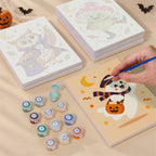 Painting one of the Pastel Halloween Pals designs next to a stack of mini canvases