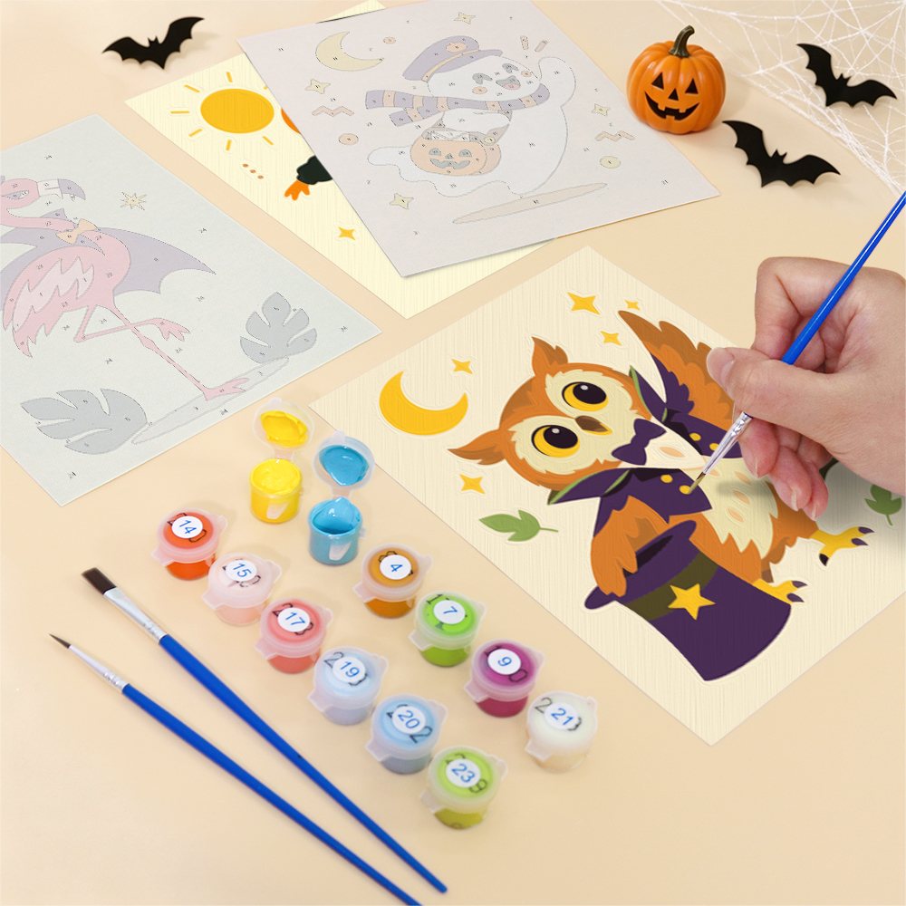 Filling in a Pastel Halloween Pals mini canvas with numbered acrylic paints and a fine brush
