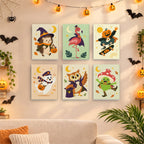 Six finished Pastel Halloween Pals mini paintings hung on a wall above a table