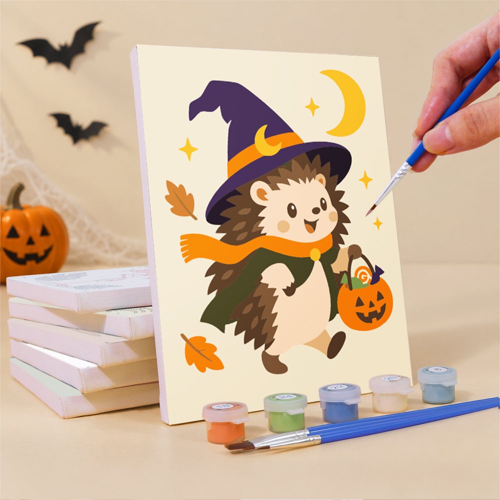 Painting a Pastel Halloween Pals mini canvas propped up beside numbered acrylic paints