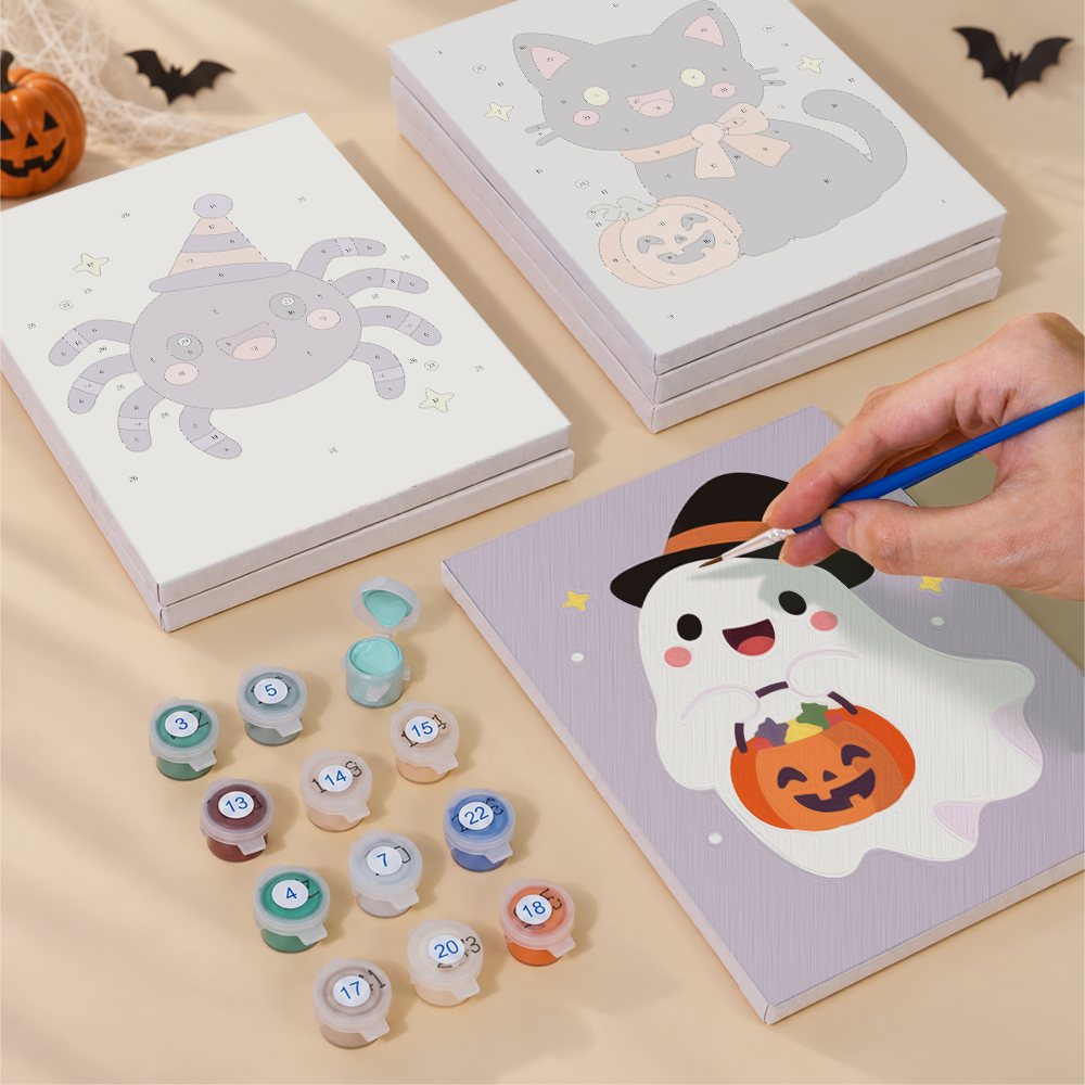 Painting one of the Pastel Kawaii Icons designs next to a stack of mini canvases