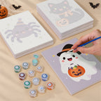 Painting one of the Pastel Kawaii Icons designs next to a stack of mini canvases