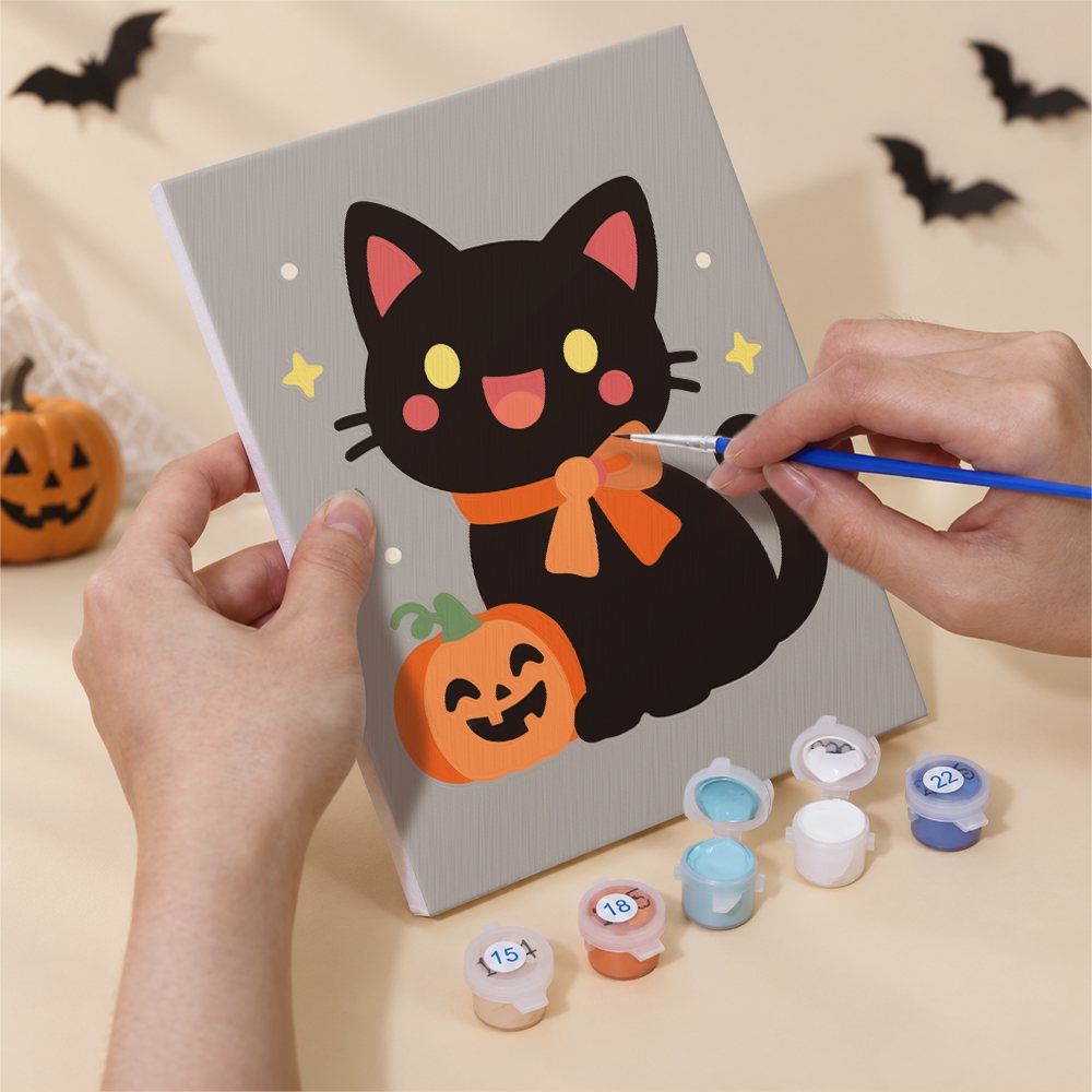Hand holding a Pastel Kawaii Icons mini canvas while painting the details