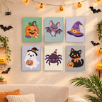 Six finished Pastel Kawaii Icons mini paintings hung on a wall above a table