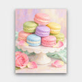 Pastel Macarons paint by numbers kit of pastel macarons stacked on a white cake stand with rose petals