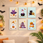 Six finished Pastel Pumpkin Pals mini paintings hung on a wall above a table