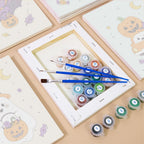 Numbered paint pots and brushes on a pre-stretched Pastel Pumpkin Pals mini canvas