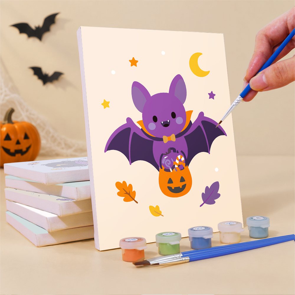 Painting a Pastel Pumpkin Pals mini canvas propped up beside numbered acrylic paints