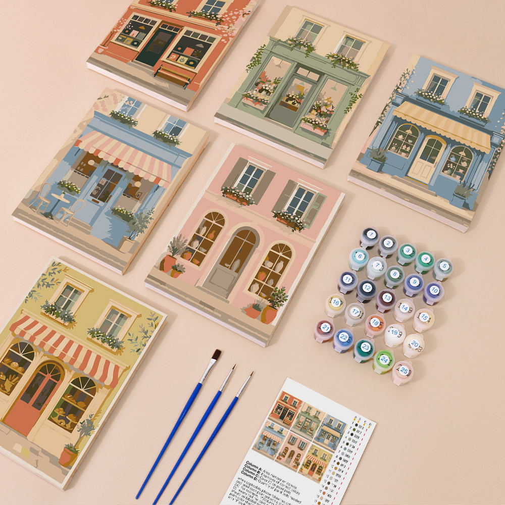 Pastel Storefronts mini paint by numbers kit with six numbered canvases, acrylic paints, brushes and layout