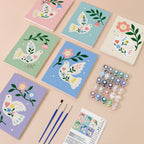 Peace Doves mini paint by numbers kit with six numbered canvases, acrylic paints, brushes and layout