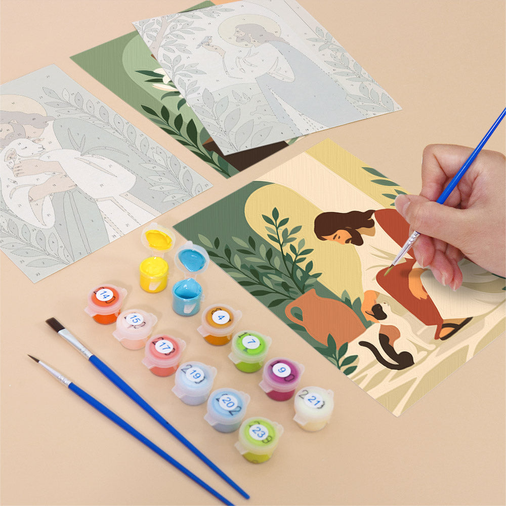 Filling in a Peaceful Faith mini canvas with numbered acrylic paints and a fine brush