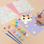 Filling in a Peekaboo Kittens mini canvas with numbered acrylic paints and a fine brush
