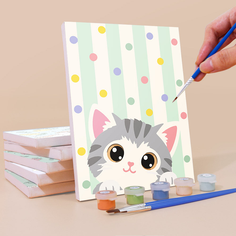 Painting a Peekaboo Kittens mini canvas propped up beside numbered acrylic paints