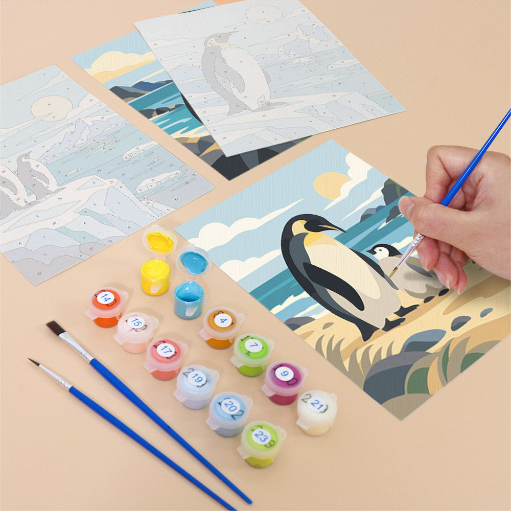 Filling in a Penguin Shores mini canvas with numbered acrylic paints and a fine brush