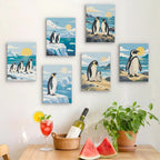 Six finished Penguin Shores mini paintings hung on a wall above a table