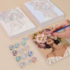 Painting one of the Peony Portraits designs next to a stack of mini canvases