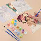 Filling in a Peony Portraits mini canvas with numbered acrylic paints and a fine brush
