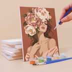 Painting a Peony Portraits mini canvas propped up beside numbered acrylic paints
