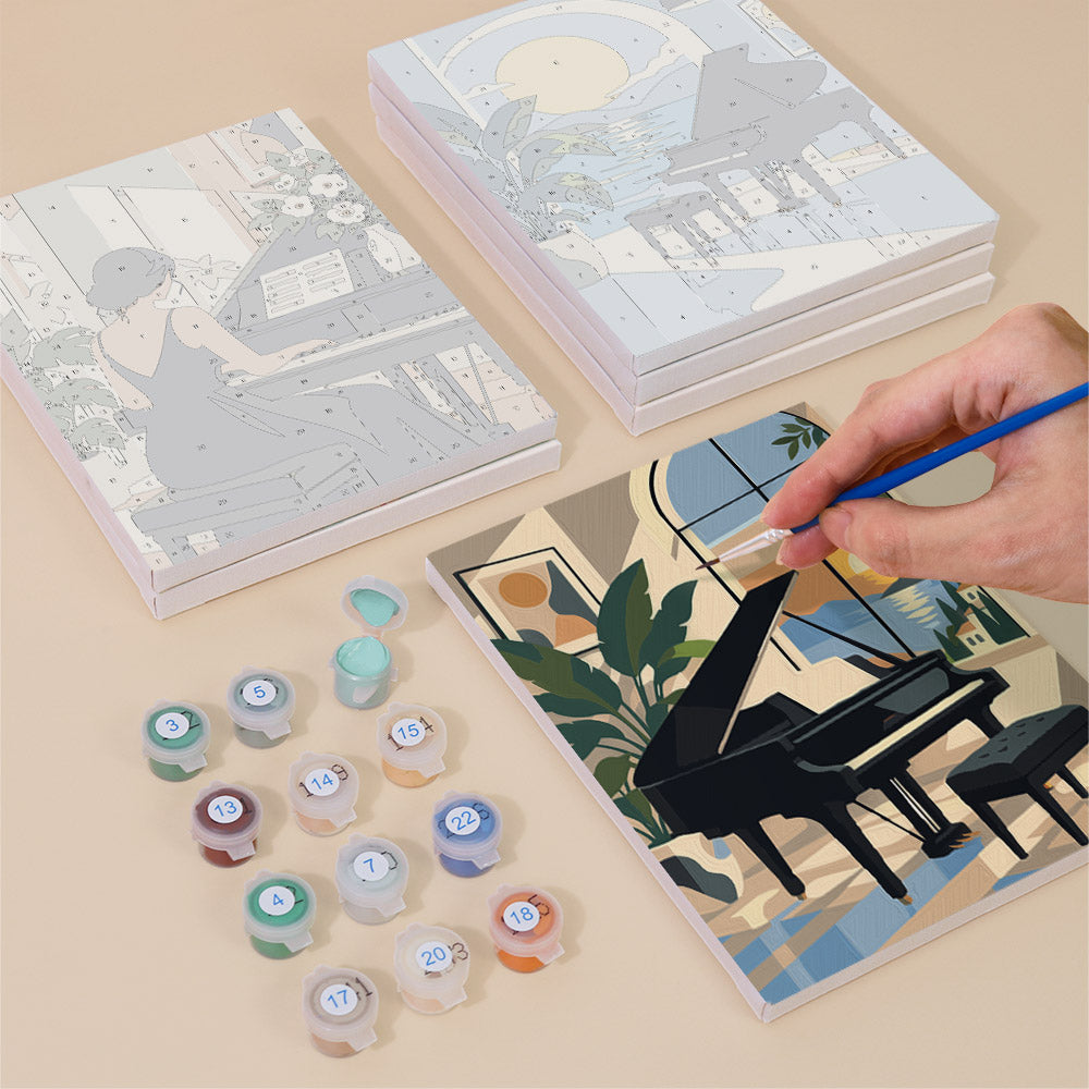 Painting one of the Piano Moments designs next to a stack of mini canvases