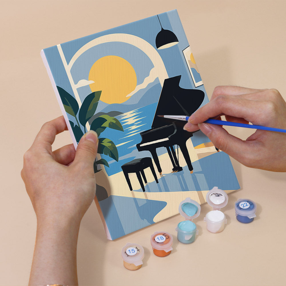 Hand holding a Piano Moments mini canvas while painting the details