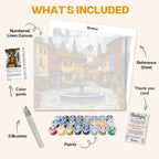 What's included in the Piazza di Colori paint by numbers kit: numbered linen canvas, reference sheet, color guide, 24 acrylic paints, 3 brushes and thank you card