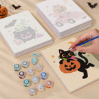 Painting one of the Pink Pumpkin Party designs next to a stack of mini canvases