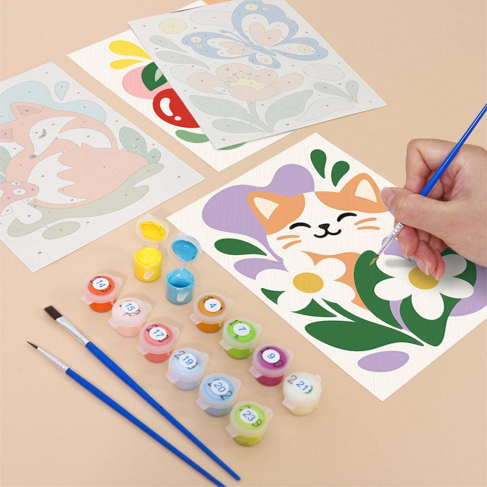 Filling in a Playful Garden mini canvas with numbered acrylic paints and a fine brush