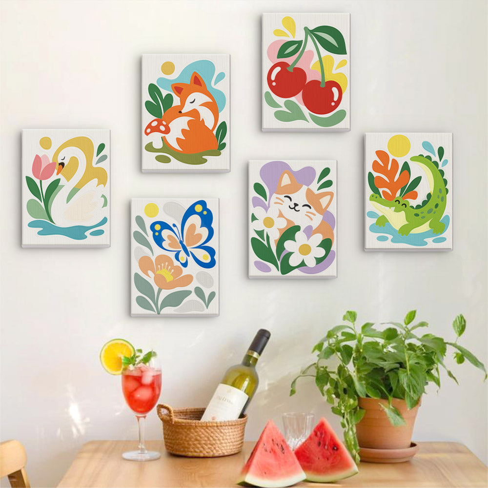 Six finished Playful Garden mini paintings hung on a wall above a table
