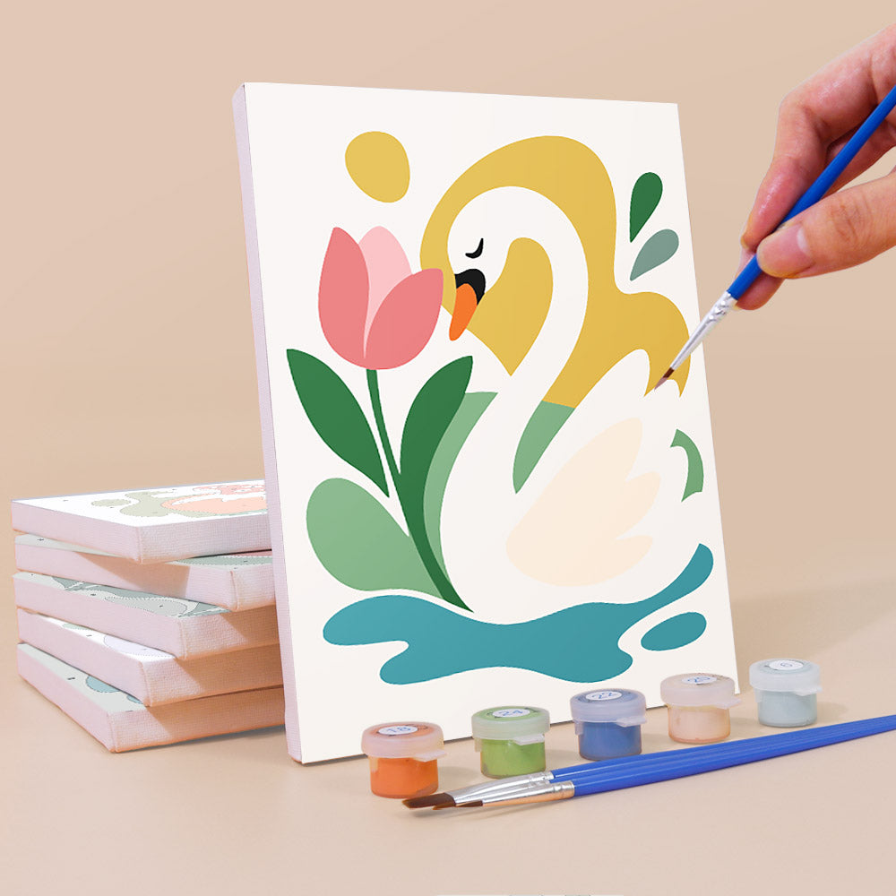 Painting a Playful Garden mini canvas propped up beside numbered acrylic paints