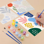 Filling in a Playful Shapes mini canvas with numbered acrylic paints and a fine brush