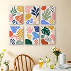 Playful Shapes mini paintings displayed as a gallery wall in a sunny kitchen